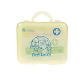 Children's first aid kit with cartoon turtle and medical cross on a light yellow case