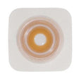 Ostomy barrier wafer with adhesive border for stoma care on white background