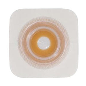 Ostomy barrier wafer with adhesive border for stoma care on white background