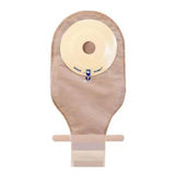 Beige ostomy pouch with adhesive barrier for medical ostomy care, isolated on white background.