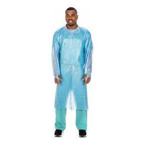 Man wearing blue disposable medical isolation gown and green scrubs, standing on white background.