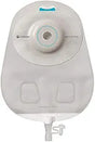 Transparent ostomy bag with adhesive backing and drainable spout for medical use.
