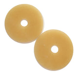 Two round ostomy skin barrier rings with central holes for medical use