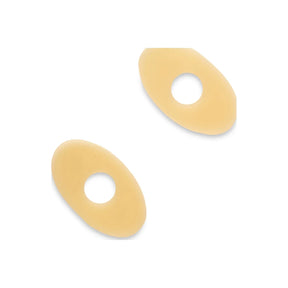 Two oval beige medical barrier rings with center holes for ostomy care