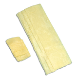 Two folded yellow absorbent underpads for medical incontinence care on a white background