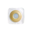 Adhesive hydrocolloid skin barrier for ostomy, round with central opening, on white background
