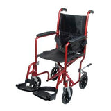 Lightweight red transport wheelchair with black seat, footrests, and small wheels.