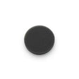 Black circular foam medical filter pad on white background, home medical accessory