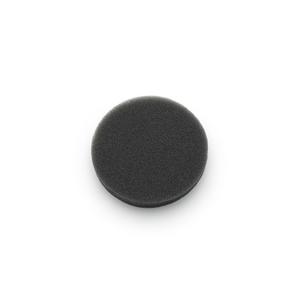 Black circular foam medical filter pad on white background, home medical accessory