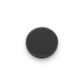 Black circular foam medical filter pad on white background, home medical accessory