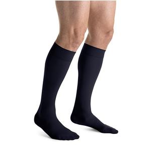 Man wearing black knee-high compression socks for medical support