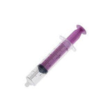 Purple oral medication syringe for home medical use, isolated on white background