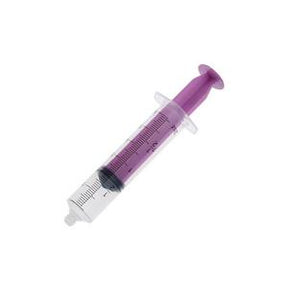 Purple oral medication syringe for home medical use, isolated on white background