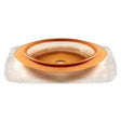 Ostomy barrier ring for stoma care, round adhesive medical supply on white background