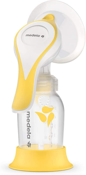 Manual breast pump with yellow and white handle, clear bottle, and measurement markings