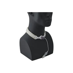 Tracheostomy tube with securement collar shown on mannequin neck for medical use