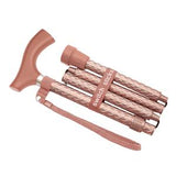 Rose gold folding walking cane with ergonomic handle and textured grip, lightweight mobility aid