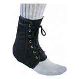 Ankle brace with laces worn over a sock for support and injury recovery
