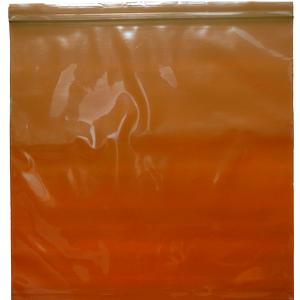 Transparent amber medical supply bag with zip closure on white background