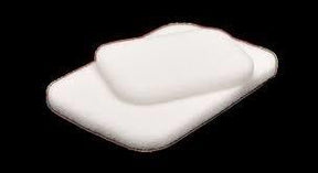 Sterile white medical gauze pads stacked on a black background