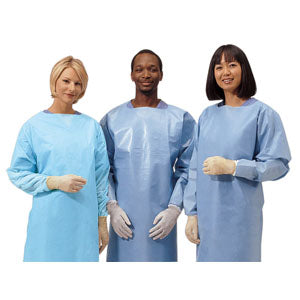 Three people wearing disposable medical isolation gowns and gloves, standing together.