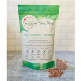 Vegan powdered meal mix bag labeled kale quinoa berries with brown powder and scoop on counter
