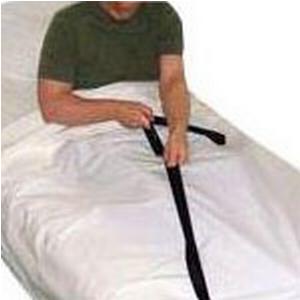 Person using black bed assist strap for mobility support on white bedding