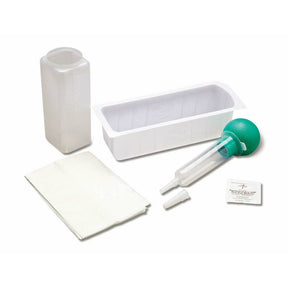 Medical wound irrigation kit with syringe, basin, solution bottle, gauze, and packet on white background