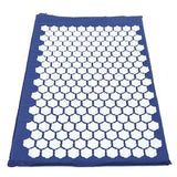 Blue acupressure mat with white plastic spike discs for pain relief and relaxation