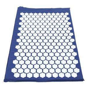 Blue acupressure mat with white plastic spike discs for pain relief and relaxation