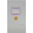 Ostomy wafer, cutting guide, and box on white background for medical supply home delivery.