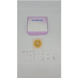 Ostomy wafer, cutting guide, and box on white background for medical supply home delivery.