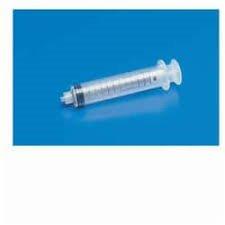 Disposable medical syringe on blue background for home healthcare use