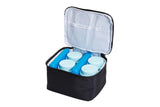 Insulated medical travel bag with blue ice packs and storage containers for medication