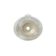 Round transparent ostomy barrier with adhesive, medical supply for stoma care on white background