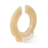 Skin barrier ring for ostomy, beige medical adhesive accessory on white background