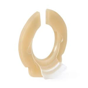 Skin barrier ring for ostomy, beige medical adhesive accessory on white background