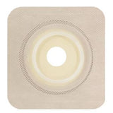 square beige ostomy barrier with central stoma opening, adhesive border, medical supply