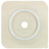 Square beige ostomy barrier with central hole for medical supplies