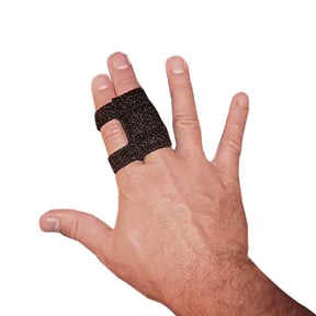 Hand wearing black medical finger splint for joint support and stabilization