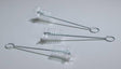 Three small wire cleaning brushes with clear bristles on a white background