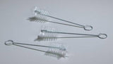 Three small wire cleaning brushes with clear bristles on a white background