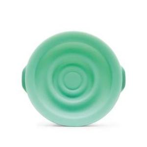 Green silicone collapsible bowl with ridged, circular design, viewed from above