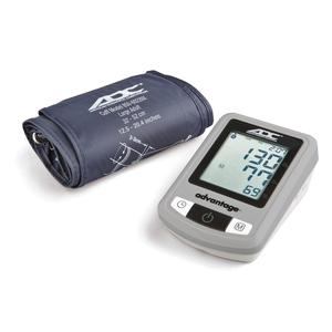 Digital blood pressure monitor with cuff and LCD display showing readings