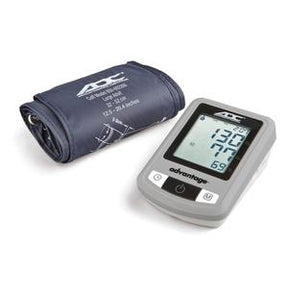 Digital blood pressure monitor with cuff and LCD display showing readings