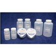 Assorted plastic medical supply bottles and containers on blue background