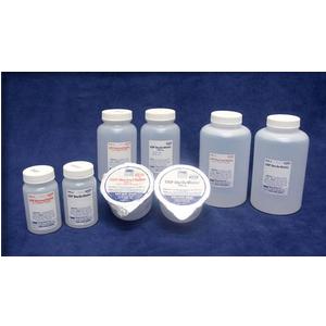 Assorted plastic medical supply bottles and containers on blue background