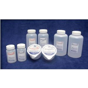 Assorted plastic medical supply bottles and containers on blue background