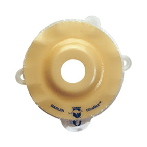 Round beige medical ostomy barrier with adhesive backing and central hole, for stoma care
