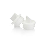 Plastic medical supply bottle adapters on white background, essential accessory for home care